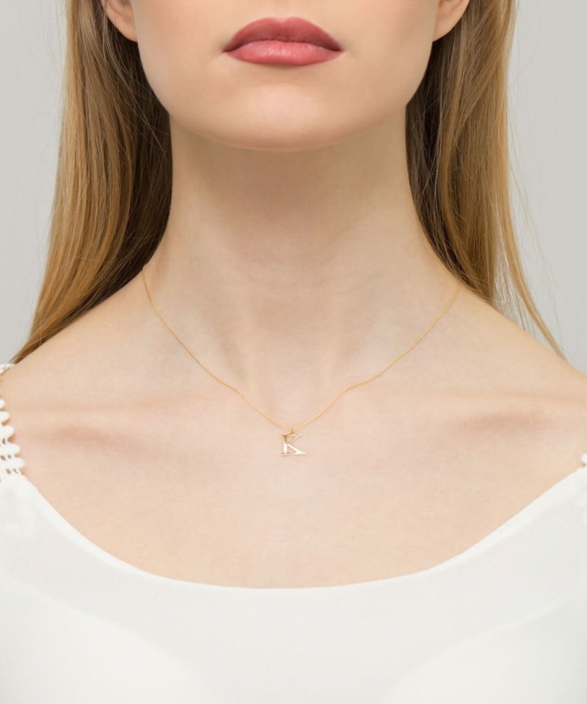 Zelta kulons ar dimanta burtu K - Goldinga