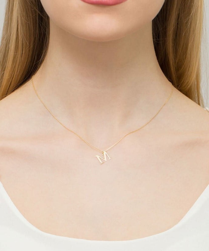 Zelta kulons ar dimanta burtu M - Goldinga