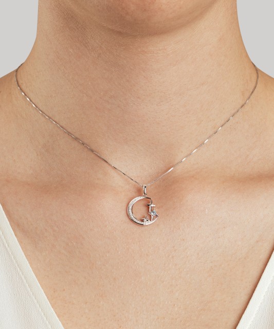 Baltā zelta kulons ar dimantiem un topāzu