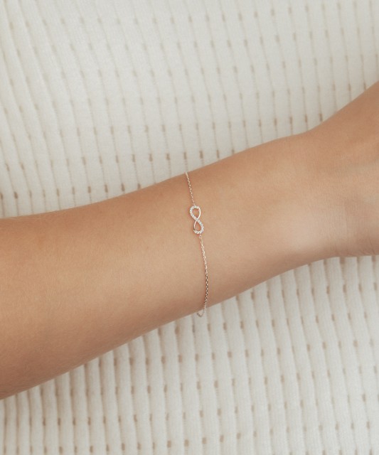 Baltā zelta aproce ar cirkoniem "Bezgalība"