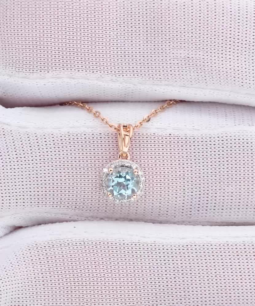 Zelta kulons ar topāzu un dimantiem